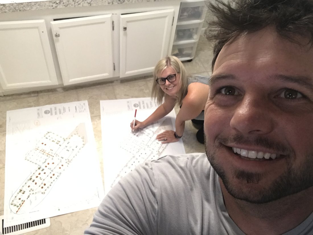 Cory pricing project plans on the floor