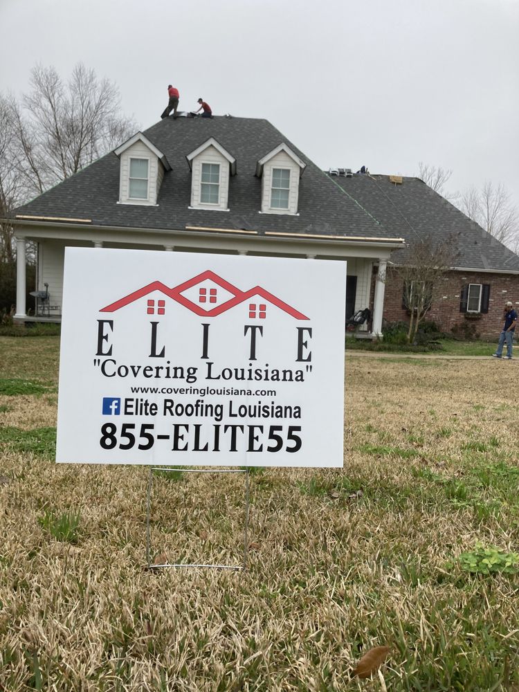 An Elite Roofing crew working on a home in Louisiana